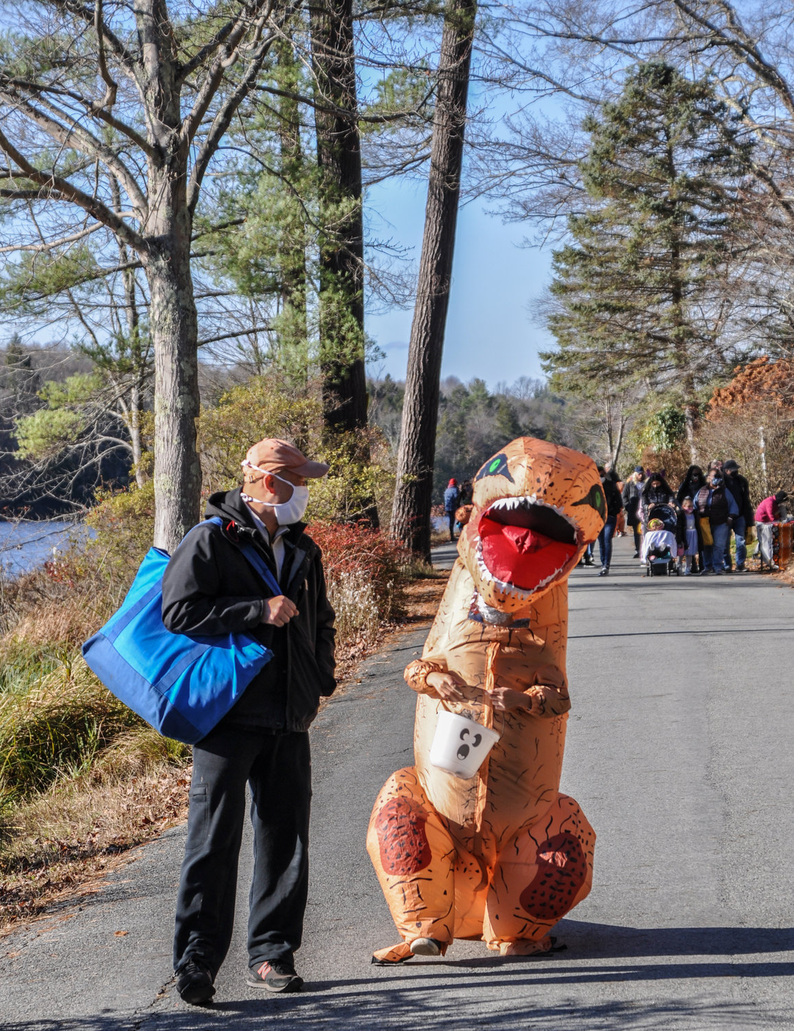 I'm not sure what struck this dinosaur as funny, but he/she was yukking it up with a masked man along the route during last weekend's Halloween walk around Smallwood lake.